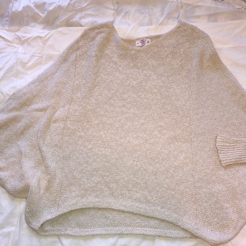 Cream colored poncho sweater